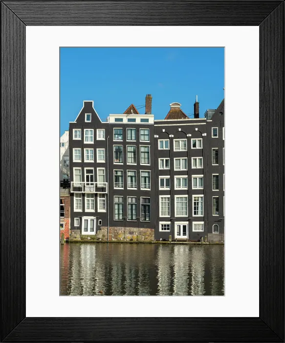 Framed Print : Dancing houses near river against sky, Damrak, Amsterdam, Netherlands Framed Print : Dancing houses near river against sky, Damrak, Amsterdam, Netherlands