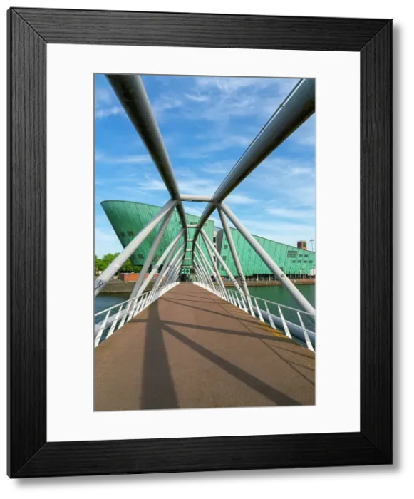 Framed Print : Mr J.J. van der Veldebrug bridge leading towards NEMO Science Museum, Oosterdok, Amsterdam, Netherlands Framed Print : Mr J.J. van der Veldebrug bridge leading towards NEMO Science Museum, Oosterdok, Amsterdam, Netherlands