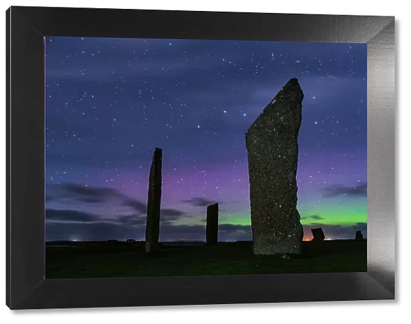 Aurora Borealis (Northern Lights) in the night sky above the Neolithic Stones of Stenness on Mainland, Orkney, Scotland. Autumn (October) 2022