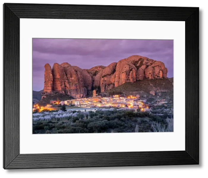 Framed Print : Scenic view of the village with the Mallos de Aguero rock formations behind, Aguero, Huesca, Aragon, Spain Framed Print : Scenic view of the village with the Mallos de Aguero rock formations behind, Aguero, Huesca, Aragon, Spain