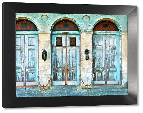 The worn doors of the historic Holy Trinity Church in the lower Faubourg Marigny section of New Orleans. Louisiana, USA