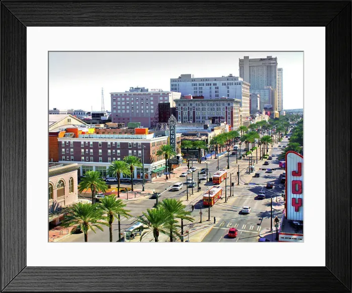 Framed Print : Red street cars on Canal Street pass by the renovated Saenger and Joy Theaters. Canal Street, New Orleans, Louisiana, USA Framed Print : Red street cars on Canal Street pass by the renovated Saenger and Joy Theaters. Canal Street, New Orleans, Louisiana, USA