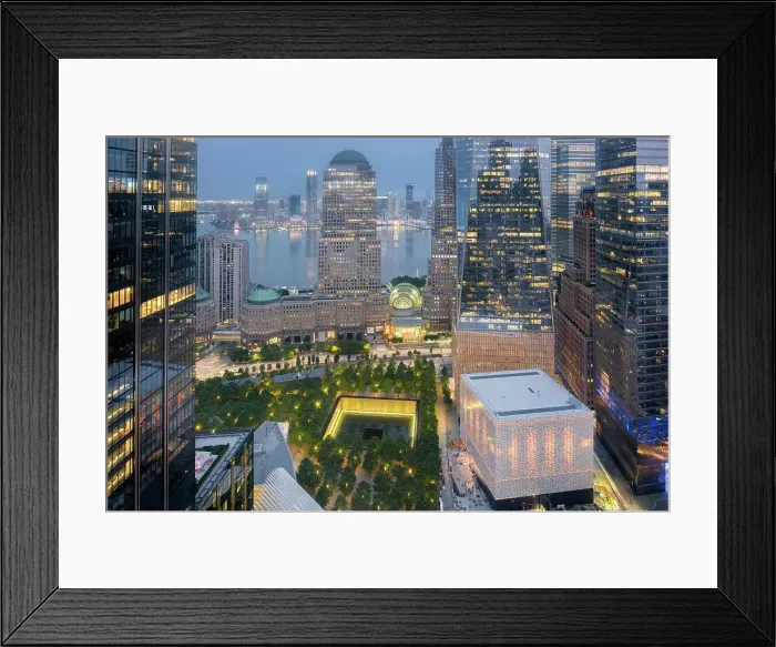 Framed Print : USA, New York, Lower Manhattan, World Trade Center, 9 / 11 Memorial & Park & Hudson River. Evening shot with illuminated buildings. Brookfield Place (architect Cesar Pelli; 1985) & PAC NYC Performing Arts Center (architect: Joshua Prince-Ramus, 2017) Framed Print : USA, New York, Lower Manhattan, World Trade Center, 9 / 11 Memorial & Park & Hudson River. Evening shot with illuminated buildings. Brookfield Place (architect Cesar Pelli; 1985) & PAC NYC Performing Arts Center (architect: Joshua Prince-Ramus, 2017)