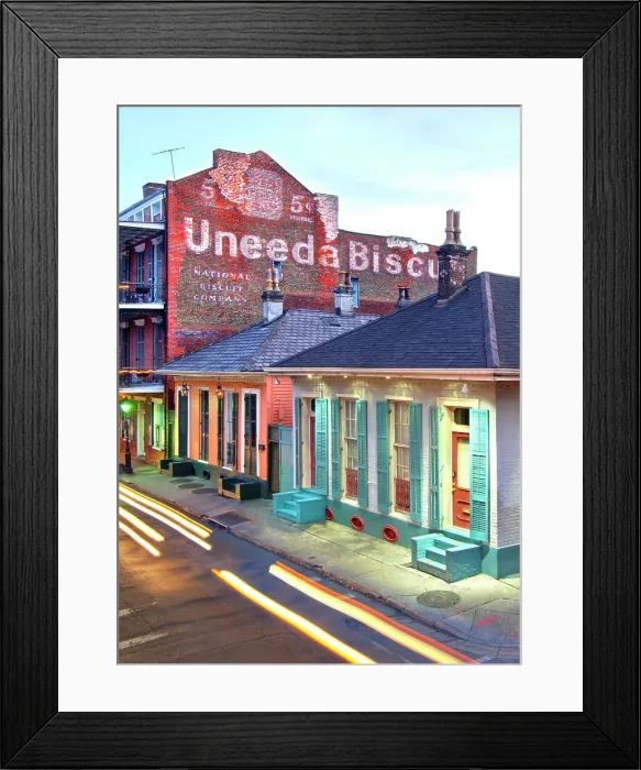 Framed Print : Streaking car lights at dusk on Dumaine Street in the French Quarter of New Orleans. The street and neighborhood contain many examples of the unique architecture found here as seen in the wood shutters and the Uneeda Biscuit sign. Louisiana, USA Framed Print : Streaking car lights at dusk on Dumaine Street in the French Quarter of New Orleans. The street and neighborhood contain many examples of the unique architecture found here as seen in the wood shutters and the Uneeda Biscuit sign. Louisiana, USA