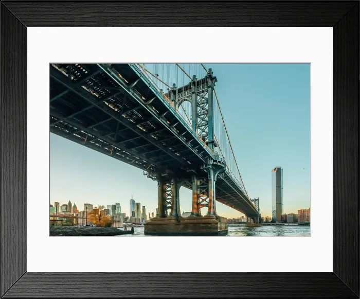 Framed Print : USA, New York City, view from below of the Manhattan bridge with the sun setting on lower Manhattan Framed Print : USA, New York City, view from below of the Manhattan bridge with the sun setting on lower Manhattan