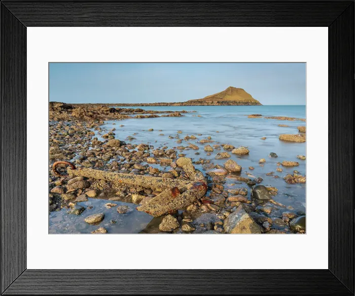 Framed Print : Rusted shipwreck anchor on the rocky shoreline near Worm's Head on the Gower Peninsula, South Wales, UK. Spring (March) 2022 Framed Print : Rusted shipwreck anchor on the rocky shoreline near Worm's Head on the Gower Peninsula, South Wales, UK. Spring (March) 2022