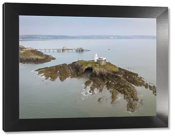 Aerial view of Mumbles Lighthouse and Pier at the eastern edge of the Gower Peninsula, Swansea, Wales, UK. Spring (March) 2022