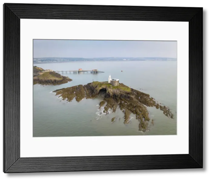 Framed Print : Aerial view of Mumbles Lighthouse and Pier at the eastern edge of the Gower Peninsula, Swansea, Wales, UK. Spring (March) 2022 Framed Print : Aerial view of Mumbles Lighthouse and Pier at the eastern edge of the Gower Peninsula, Swansea, Wales, UK. Spring (March) 2022