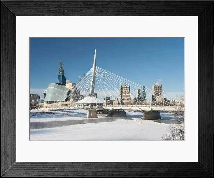 Framed Print : Winnipeg skyline with the Canadian Museum for Human Rights (CMHR) and the Esplanade Riel Bridge and the Red River in winter, Winnipeg, Manitoba, Canada Framed Print : Winnipeg skyline with the Canadian Museum for Human Rights (CMHR) and the Esplanade Riel Bridge and the Red River in winter, Winnipeg, Manitoba, Canada