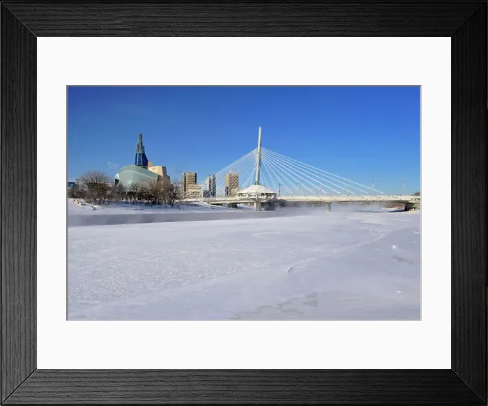 Framed Print : Winnipeg skyline with the Canadian Museum for Human Rights (CMHR) and the Esplanade Riel Bridge and the Red River in winter, Winnipeg, Manitoba, Canada Framed Print : Winnipeg skyline with the Canadian Museum for Human Rights (CMHR) and the Esplanade Riel Bridge and the Red River in winter, Winnipeg, Manitoba, Canada