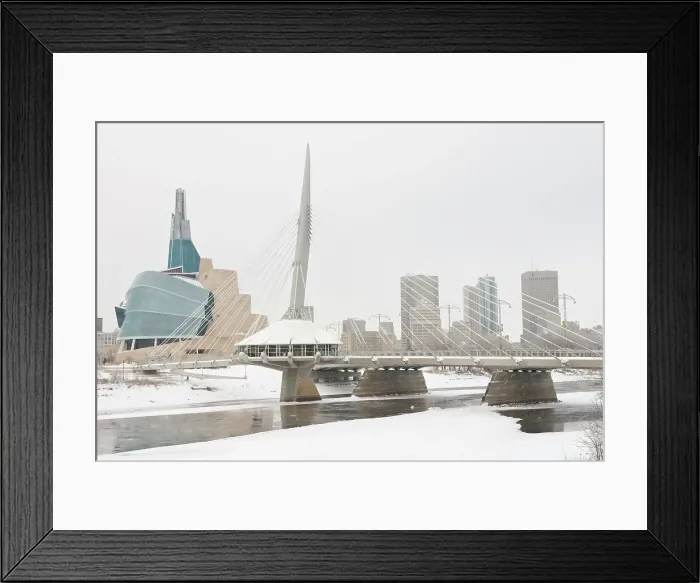 Framed Print : Winnipeg skyline with the Canadian Museum for Human Rights (CMHR) and the Esplanade Riel Bridge and the Red River in winter, Winnipeg, Manitoba, Canada Framed Print : Winnipeg skyline with the Canadian Museum for Human Rights (CMHR) and the Esplanade Riel Bridge and the Red River in winter, Winnipeg, Manitoba, Canada