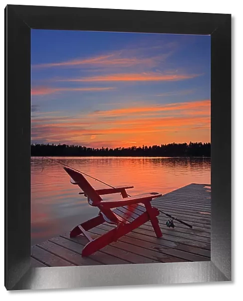 Muskoka chair at Star Lake at sunset Whiteshell Provincial Park, Manitoba, Canada