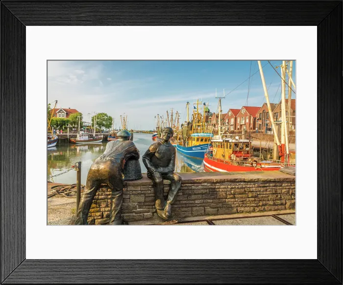 Framed Print : Bronze statues of fishermen in the harbor of Neuharlingersiel, East Frisia, Lower Saxony, Germany