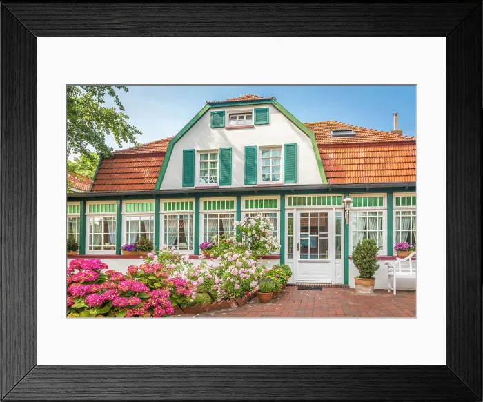 Framed Print : Traditional house in the village center of Spiekeroog, East Frisian Islands, East Frisia, Lower Saxony, Germany Framed Print : Traditional house in the village center of Spiekeroog, East Frisian Islands, East Frisia, Lower Saxony, Germany