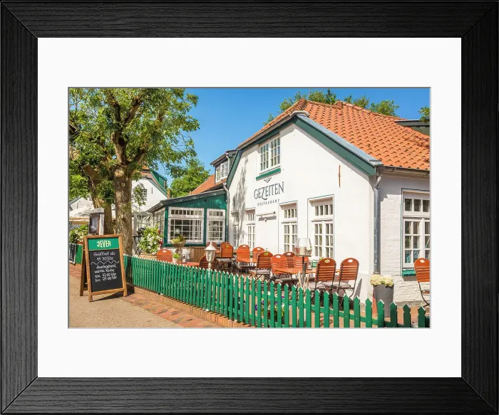 Framed Print : Traditional restaurant in the village center of Spiekeroog, East Frisian Islands, East Frisia, Lower Saxony, Germany Framed Print : Traditional restaurant in the village center of Spiekeroog, East Frisian Islands, East Frisia, Lower Saxony, Germany