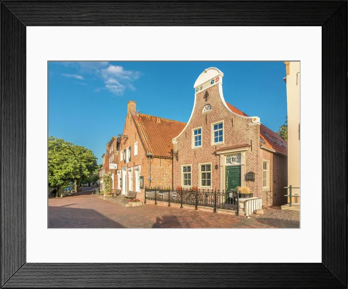 Framed Print : Historic brick houses at the harbor in Greetsiel, East Frisia, Lower Saxony, Germany Framed Print : Historic brick houses at the harbor in Greetsiel, East Frisia, Lower Saxony, Germany