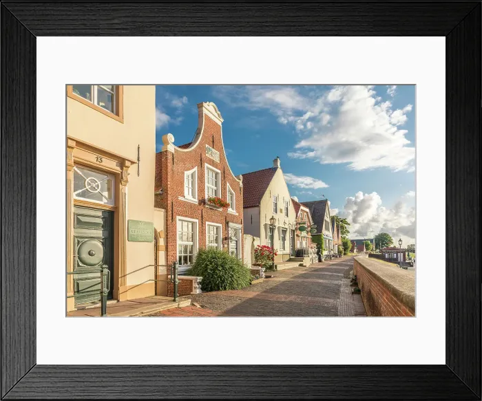 Framed Print : Historic brick houses at the harbor in Greetsiel, East Frisia, Lower Saxony, Germany Framed Print : Historic brick houses at the harbor in Greetsiel, East Frisia, Lower Saxony, Germany