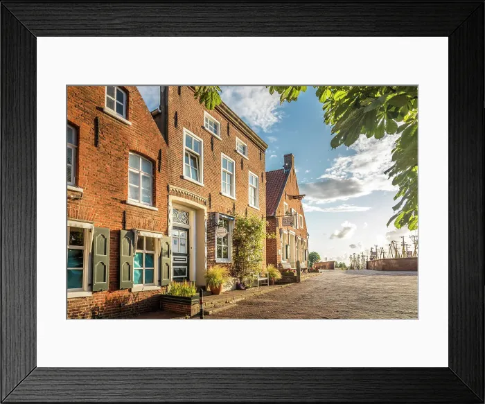 Framed Print : Historic brick houses at the harbor in Greetsiel, East Frisia, Lower Saxony, Germany Framed Print : Historic brick houses at the harbor in Greetsiel, East Frisia, Lower Saxony, Germany