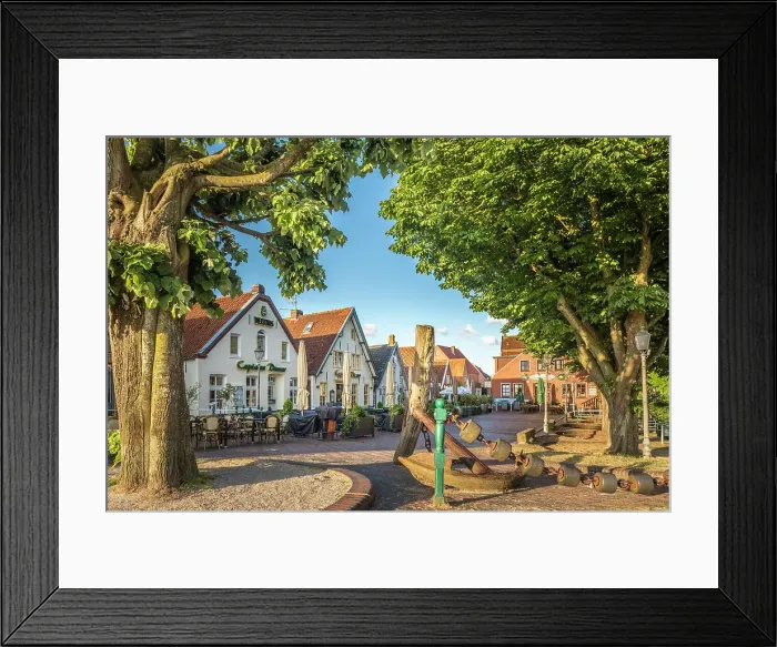 Framed Print : Old anchor and houses at the harbor of Greetsiel, East Frisia, Lower Saxony, Germany Framed Print : Old anchor and houses at the harbor of Greetsiel, East Frisia, Lower Saxony, Germany