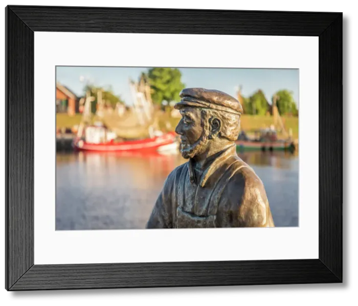 Framed Print : Bronze statue Fisherman (artist Hans-Christian Petersen) harbor of Greetsiel, East Frisia, Lower Saxony, Germany Framed Print : Bronze statue Fisherman (artist Hans-Christian Petersen) harbor of Greetsiel, East Frisia, Lower Saxony, Germany