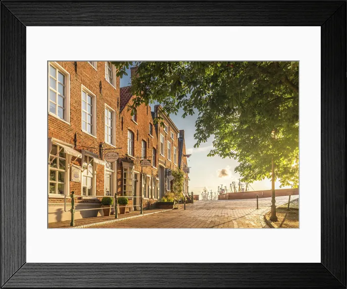 Framed Print : Historic brick houses at the harbor in Greetsiel, East Frisia, Lower Saxony, Germany Framed Print : Historic brick houses at the harbor in Greetsiel, East Frisia, Lower Saxony, Germany