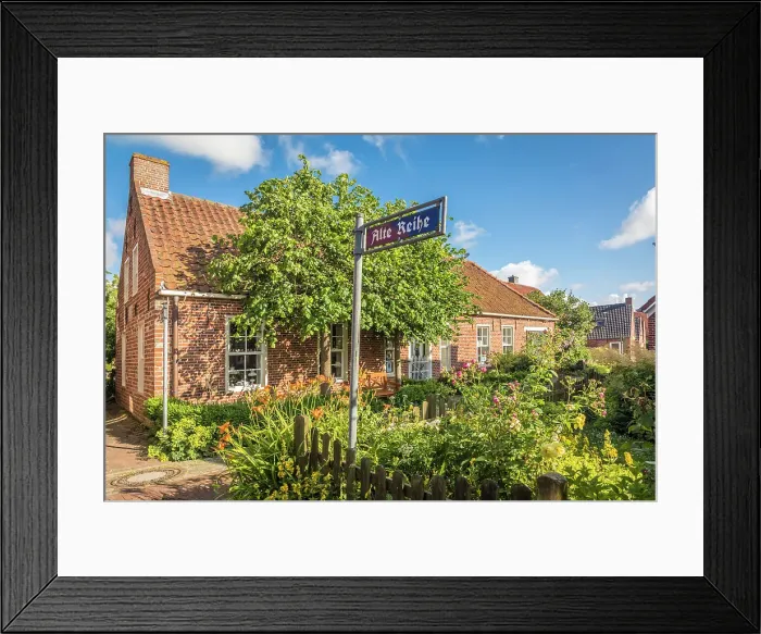 Framed Print : Idyllic cottage garden in the village of Pilsum, Krummhoern, East Frisia, Lower Saxony, Germany