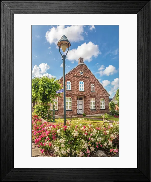 Framed Print : Historic brick house and lush floral decorations in the village of Rysum, Krummhoern, East Frisia, Lower Saxony, Germany Framed Print : Historic brick house and lush floral decorations in the village of Rysum, Krummhoern, East Frisia, Lower Saxony, Germany