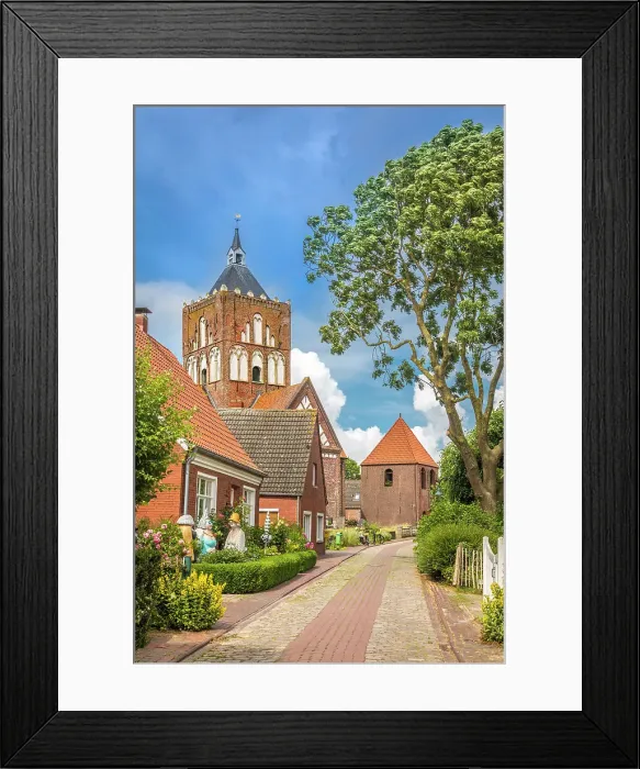 Framed Print : Village street and Kreuzkirche Pilsum, Krummhoern, East Frisia, Lower Saxony, Germany Framed Print : Village street and Kreuzkirche Pilsum, Krummhoern, East Frisia, Lower Saxony, Germany