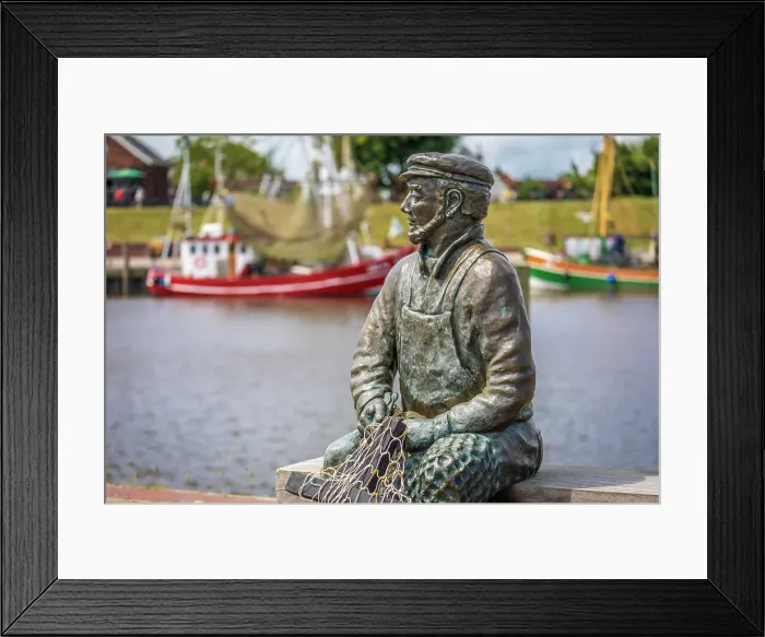 Framed Print : Bronze statue Netzflicker (artist Hans-Christian Petersen) harbor of Greetsiel, East Frisia, Lower Saxony, Germany Framed Print : Bronze statue Netzflicker (artist Hans-Christian Petersen) harbor of Greetsiel, East Frisia, Lower Saxony, Germany