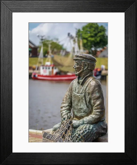 Framed Print : Bronze statue Netzflicker (artist Hans-Christian Petersen) harbor of Greetsiel, East Frisia, Lower Saxony, Germany Framed Print : Bronze statue Netzflicker (artist Hans-Christian Petersen) harbor of Greetsiel, East Frisia, Lower Saxony, Germany
