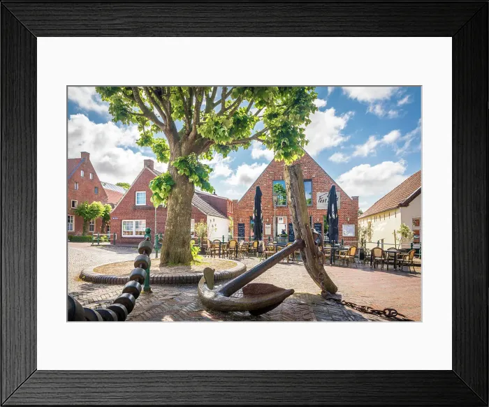 Framed Print : Old anchor and houses at the harbor of Greetsiel, East Frisia, Lower Saxony, Germany Framed Print : Old anchor and houses at the harbor of Greetsiel, East Frisia, Lower Saxony, Germany