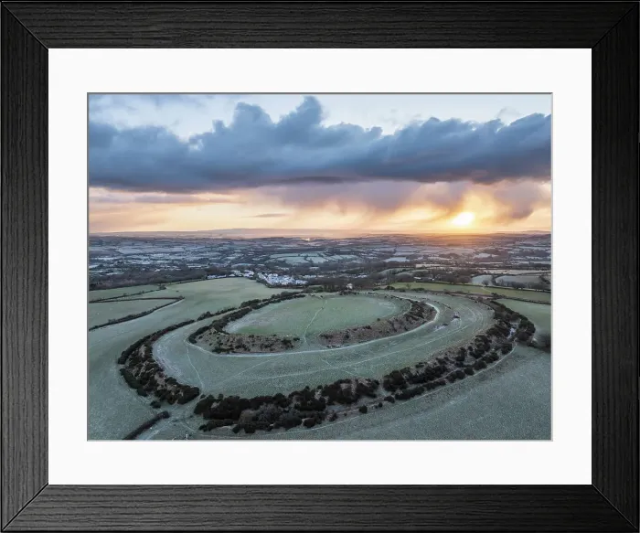 Framed Print : Aerial view of winter sunrise above Warbstow Bury, an Iron Age Hillfort near Davidstow in Cornwall, England. Winter (January) 2024