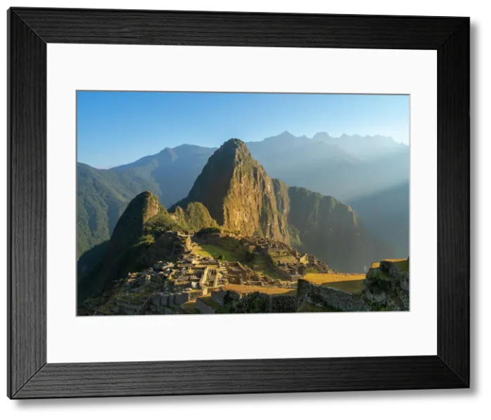 Framed Print : Historic ancient archeological Incan Machu Picchu on mountain in Andes at sunrise, Cuzco Region, Peru Framed Print : Historic ancient archeological Incan Machu Picchu on mountain in Andes at sunrise, Cuzco Region, Peru
