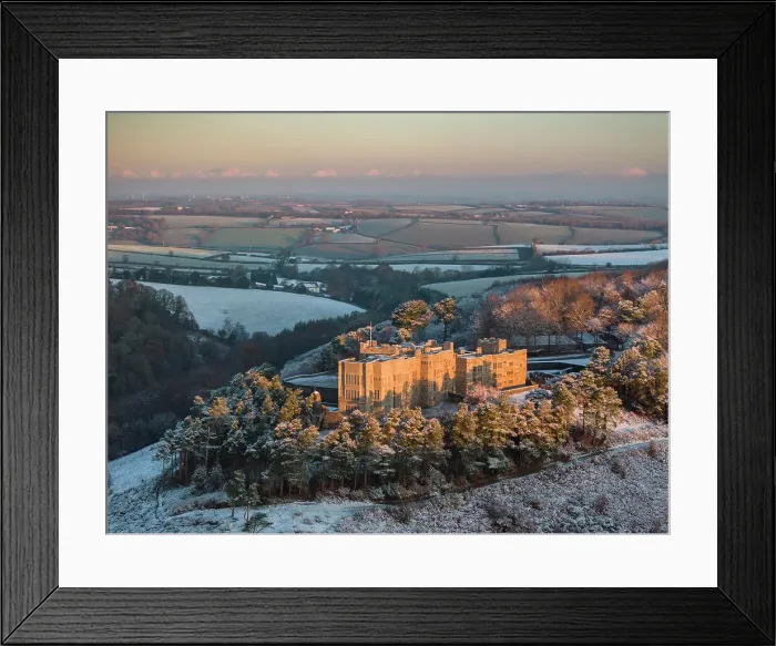 Framed Print : Aerial view of Castle Drogo on a snowy winter morning, Dartmoor, Devon, England. Winter (December) 2023