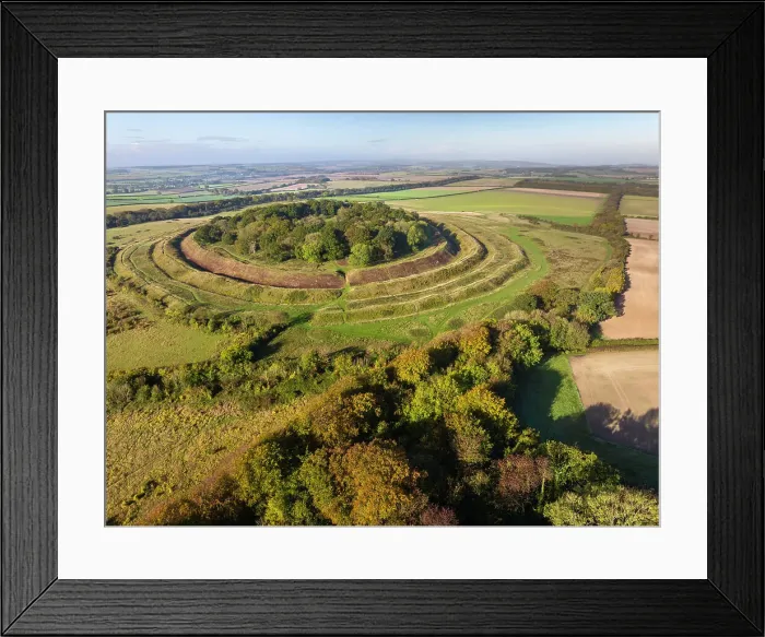 Framed Print : Aerial view of Badbury Rings Iron Age Hillfort near Wimborne, Dorset, England. Autumn (October) 2023