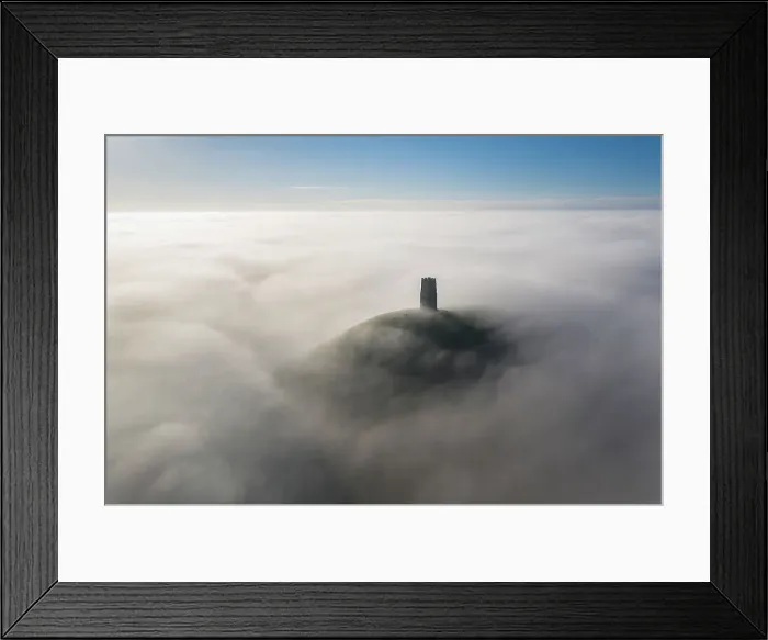 Framed Print : Aerial view of St Michaels Tower and Glastonbury Tor, surrounded by a sea of mist, Somerset, England. Winter (December) 2022 Framed Print : Aerial view of St Michaels Tower and Glastonbury Tor, surrounded by a sea of mist, Somerset, England. Winter (December) 2022