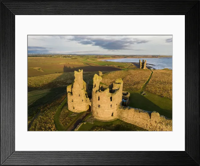 Framed Print : Aerial view of Dunstanburgh Castle on the Northumbrian coast, Embleton, Northumberland, England. Autumn (October) 2021 Framed Print : Aerial view of Dunstanburgh Castle on the Northumbrian coast, Embleton, Northumberland, England. Autumn (October) 2021
