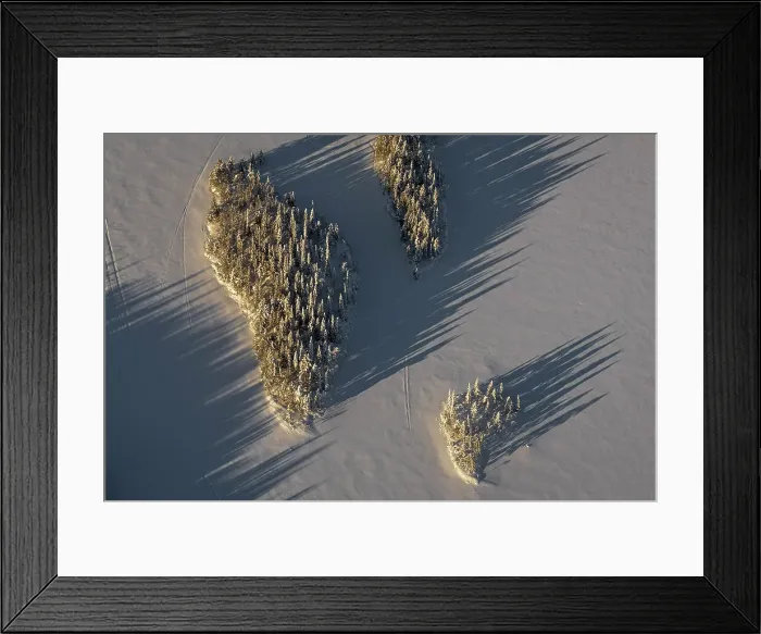 Framed Print : Aerial of islands in frozen lake, Kuusamo, Finland Framed Print : Aerial of islands in frozen lake, Kuusamo, Finland