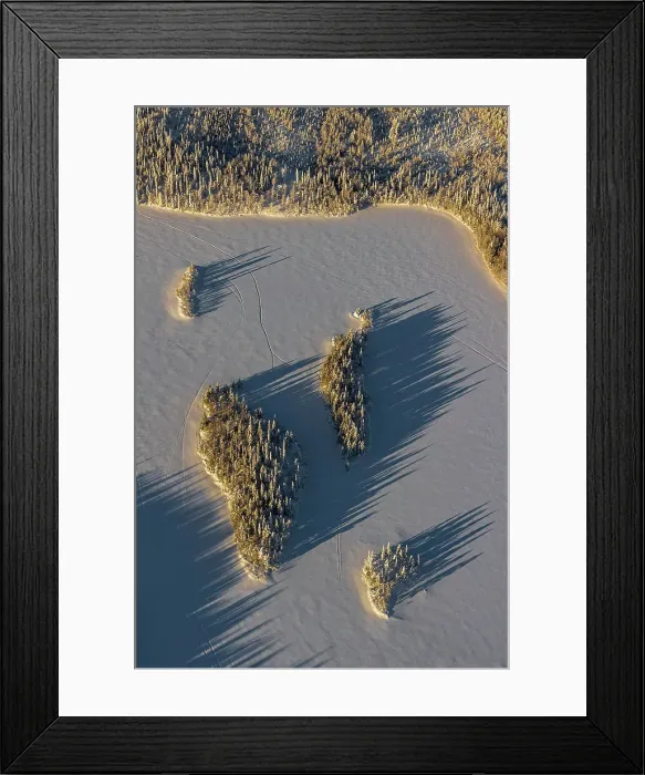 Framed Print : Aerial of islands in frozen lake, Kuusamo, Finland Framed Print : Aerial of islands in frozen lake, Kuusamo, Finland