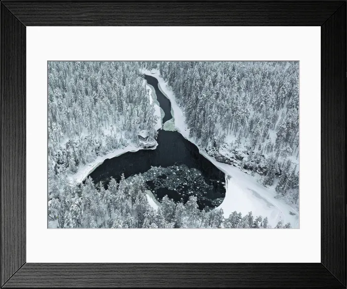 Framed Print : Aerial of riverside hut & snow-covered forest, Oulanka National Park, Finland Framed Print : Aerial of riverside hut & snow-covered forest, Oulanka National Park, Finland