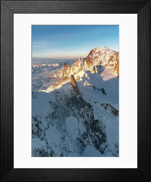 Framed Print : Aerial view of Dent du Geant rock pinnacle in Mont Blanc Massif covered with snow at dawn, Chamonix, Haute Savoie, France Framed Print : Aerial view of Dent du Geant rock pinnacle in Mont Blanc Massif covered with snow at dawn, Chamonix, Haute Savoie, France