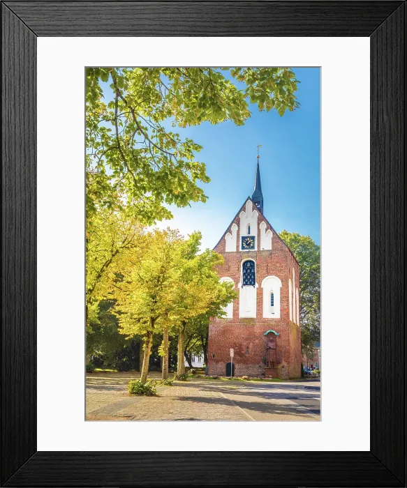 Framed Print : Early Gothic bell tower of the Ludgeri Church on the market square in Norden, East Frisia, Lower Saxony, Germany Framed Print : Early Gothic bell tower of the Ludgeri Church on the market square in Norden, East Frisia, Lower Saxony, Germany
