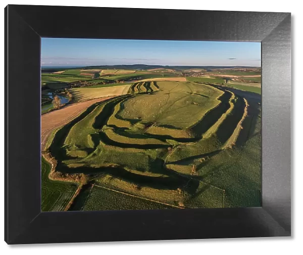 Aerial view of Iron Age Hillfort Maiden Castle near Dorchester, Dorset, England. Winter (January) 2024