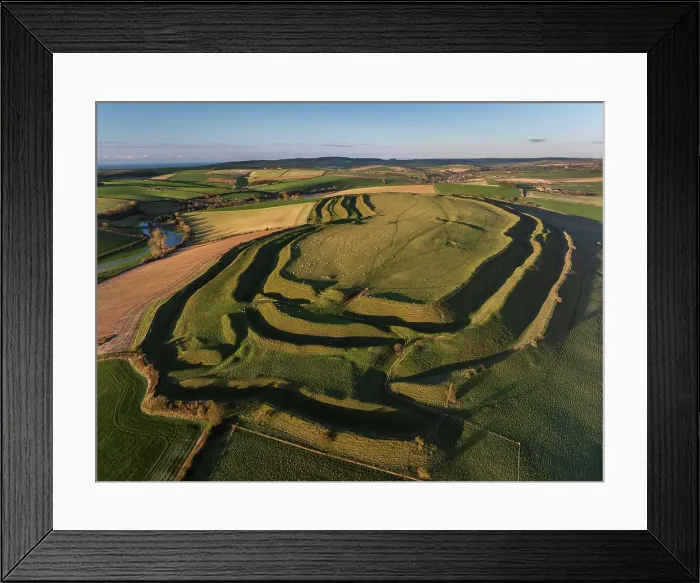 Framed Print : Aerial view of Iron Age Hillfort Maiden Castle near Dorchester, Dorset, England. Winter (January) 2024 Framed Print : Aerial view of Iron Age Hillfort Maiden Castle near Dorchester, Dorset, England. Winter (January) 2024