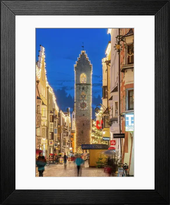 Framed Print : Night view of the main street and Zwolferturm medieval tower decorated with Christmas lights, Sterzing-Vipiteno, South Tyrol, Italy Framed Print : Night view of the main street and Zwolferturm medieval tower decorated with Christmas lights, Sterzing-Vipiteno, South Tyrol, Italy