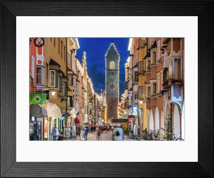 Framed Print : Night view of the main street and Zwolferturm medieval tower decorated with Christmas lights, Sterzing-Vipiteno, South Tyrol, Italy Framed Print : Night view of the main street and Zwolferturm medieval tower decorated with Christmas lights, Sterzing-Vipiteno, South Tyrol, Italy