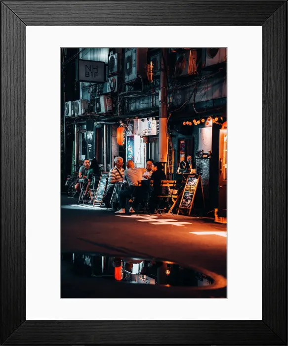 Framed Print : Friends chat and drink at a table in the streets of Osaka at night. Japan Framed Print : Friends chat and drink at a table in the streets of Osaka at night. Japan
