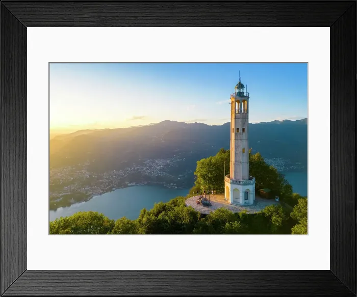 Framed Print : Aerial view of the Faro Voltiano (Volta Lighthouse) of Brunate overlooking Como and Como Lake in summer at sunset. Brunate, Province of Como, Lombardy, Italy Framed Print : Aerial view of the Faro Voltiano (Volta Lighthouse) of Brunate overlooking Como and Como Lake in summer at sunset. Brunate, Province of Como, Lombardy, Italy