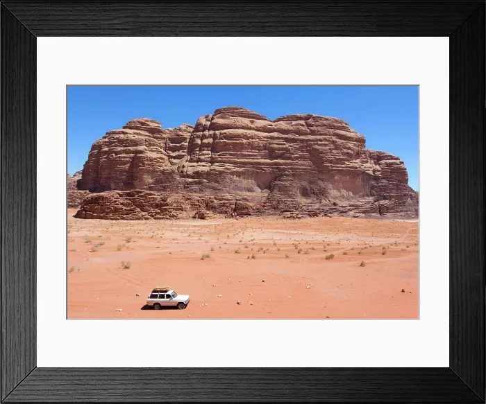 Framed Print : A 4x4 off-road vehicle car in the Wadi Rum desert, Aqaba, Jordan, Middle East. Declared a UNESCO World Heritage Site since 2011