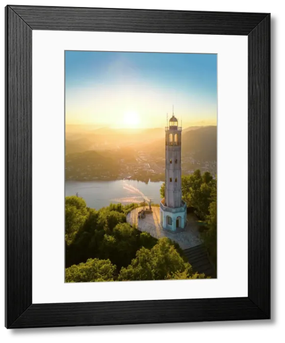 Framed Print : Aerial view of the Faro Voltiano (Volta Lighthouse) of Brunate overlooking Como and Como Lake in summer at sunset. Brunate, Province of Como, Lombardy, Italy Framed Print : Aerial view of the Faro Voltiano (Volta Lighthouse) of Brunate overlooking Como and Como Lake in summer at sunset. Brunate, Province of Como, Lombardy, Italy